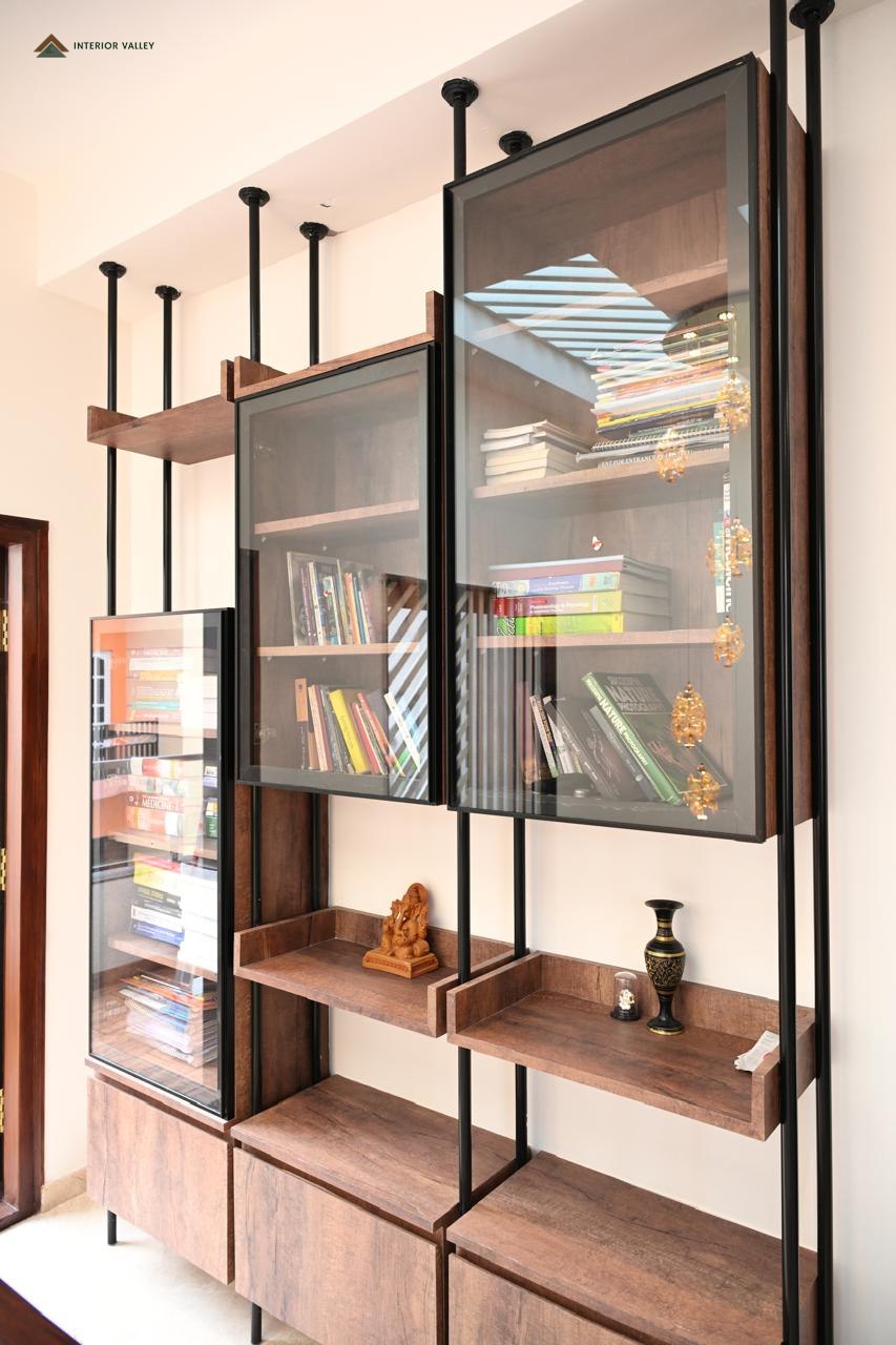 Display and book unit in glass with a slim black frame