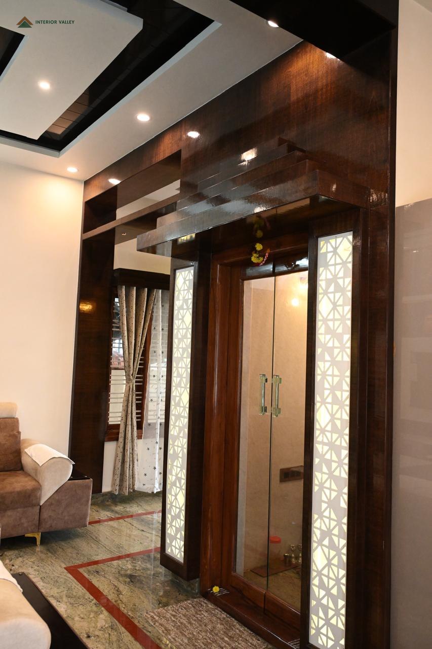 Entrance lobby with wood panelling and frosted glass doors