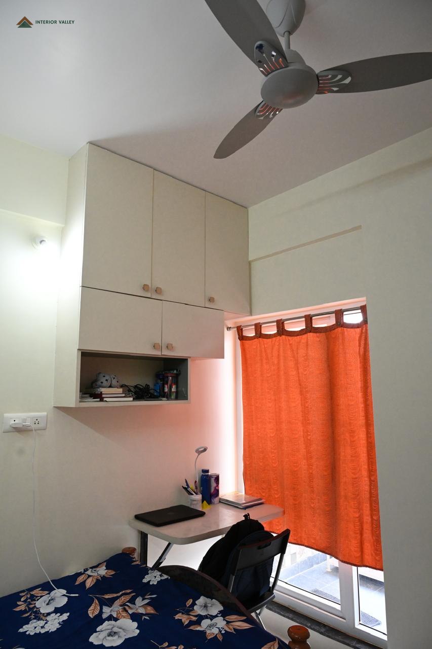 Compact study and utility corner with overhead storage
