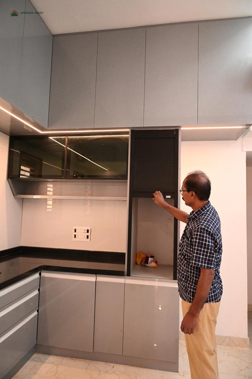 Modular kitchen with glass-fronted upper units